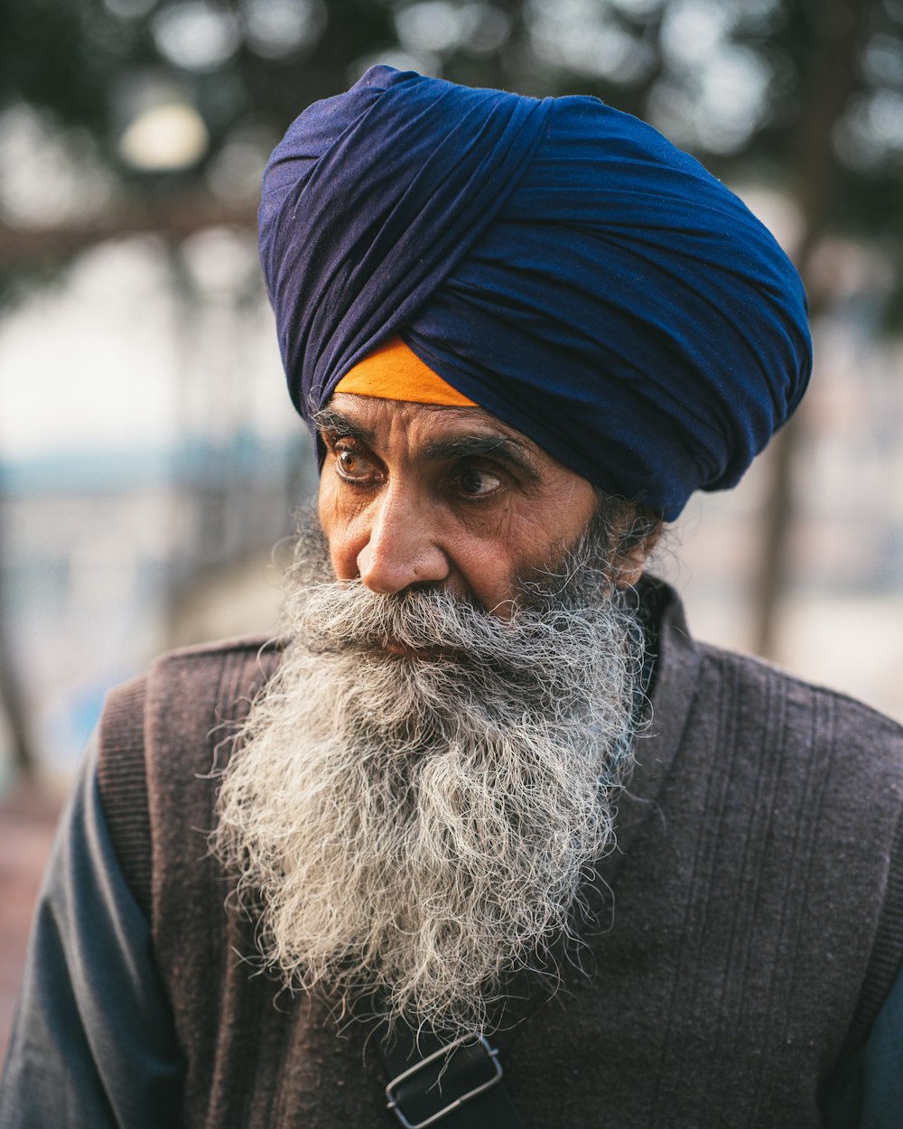 a man with a blue turban on his head