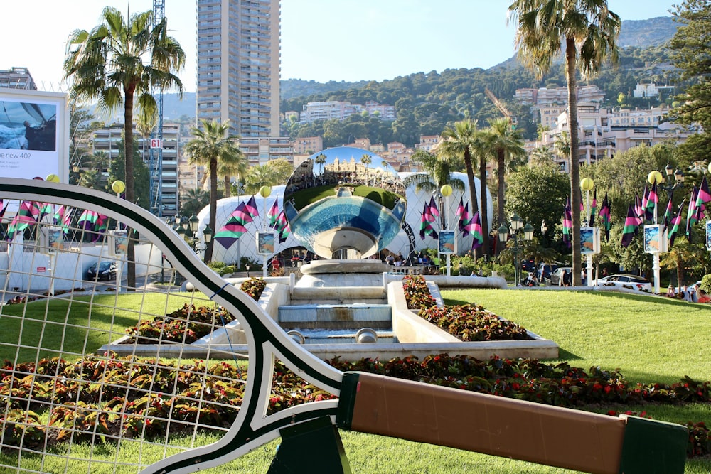 a view of a park with a lot of trees and buildings in the background