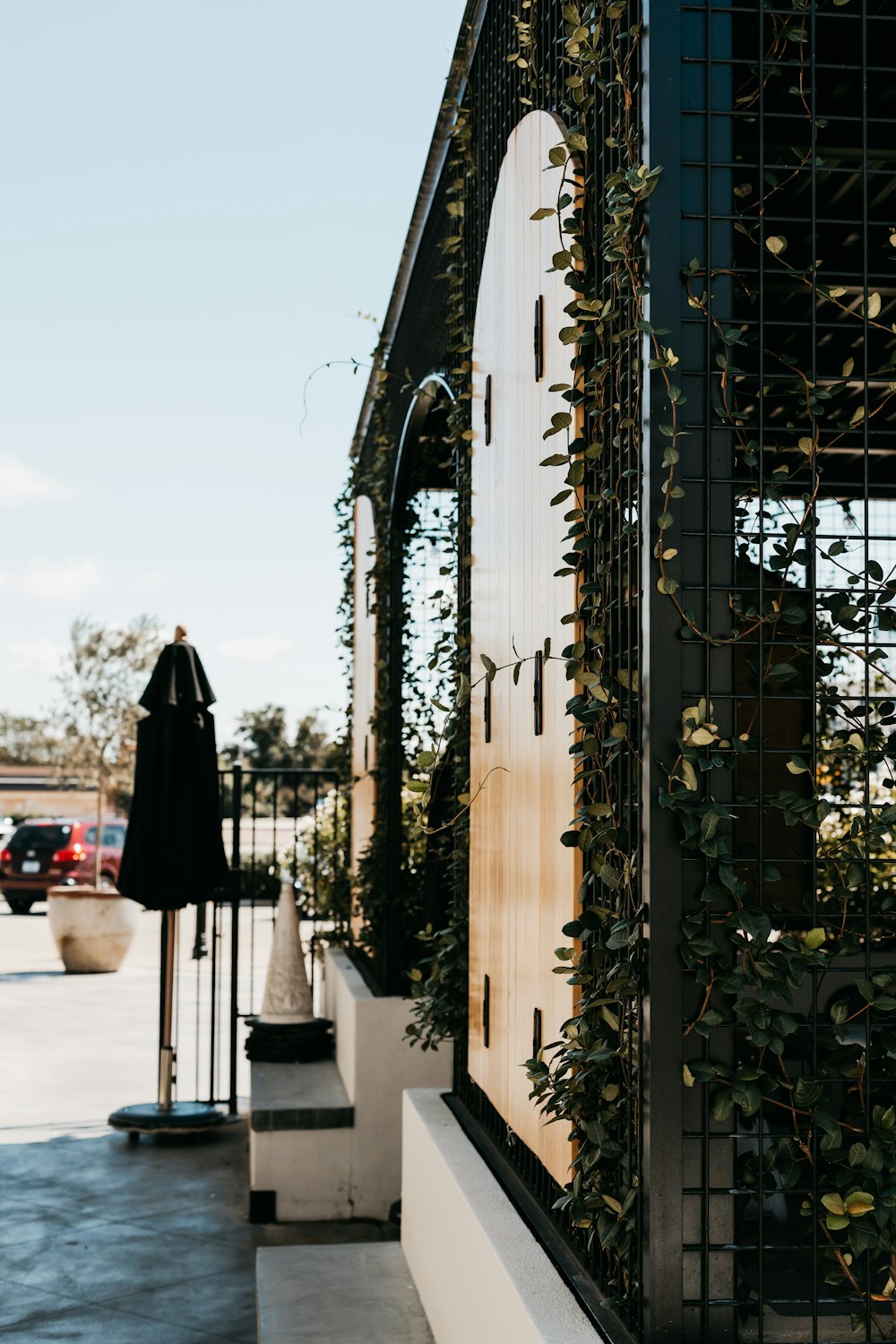 a building with a bunch of plants growing on the side of it