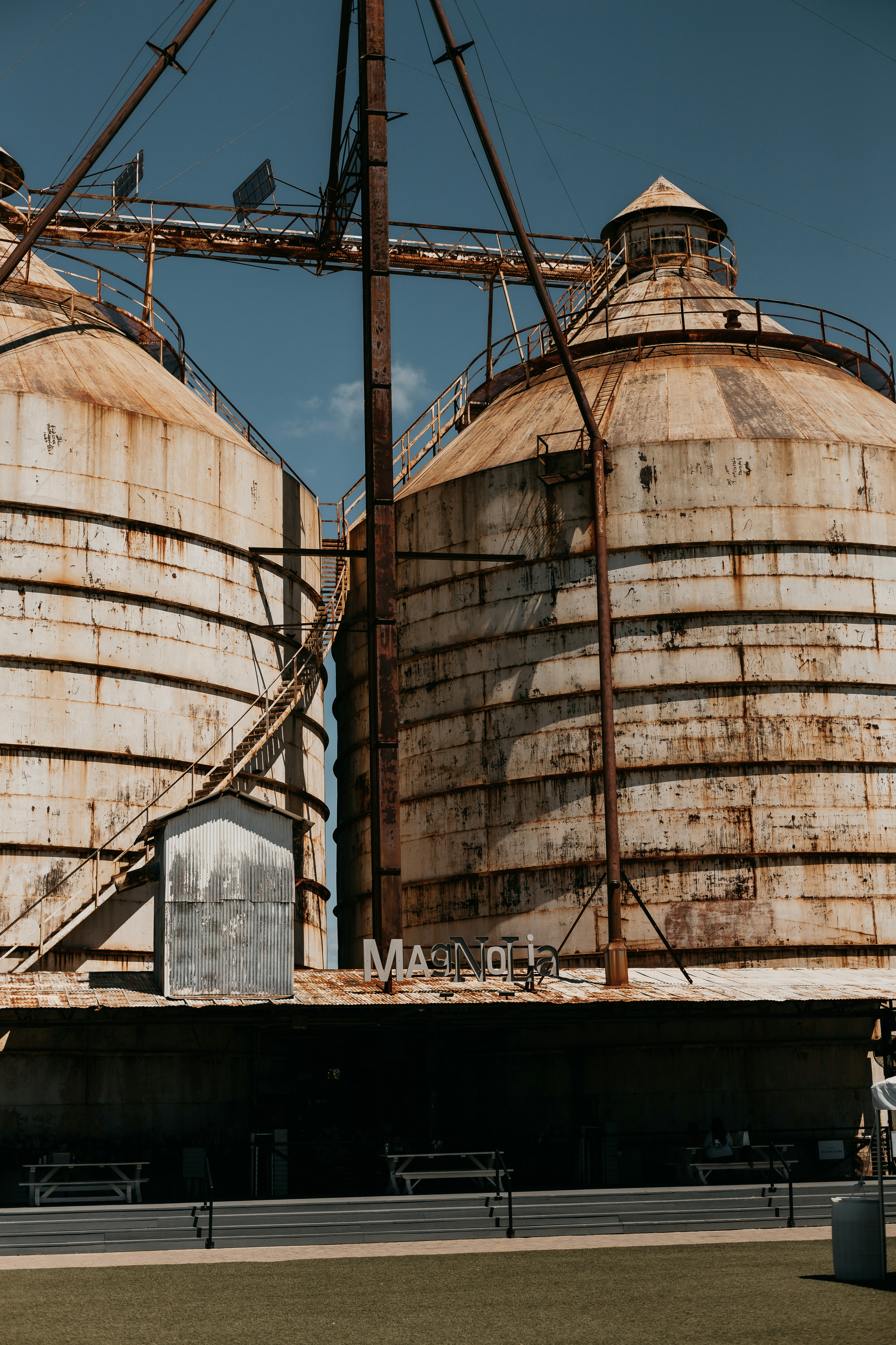 an old grain silos sits in the middle of a field