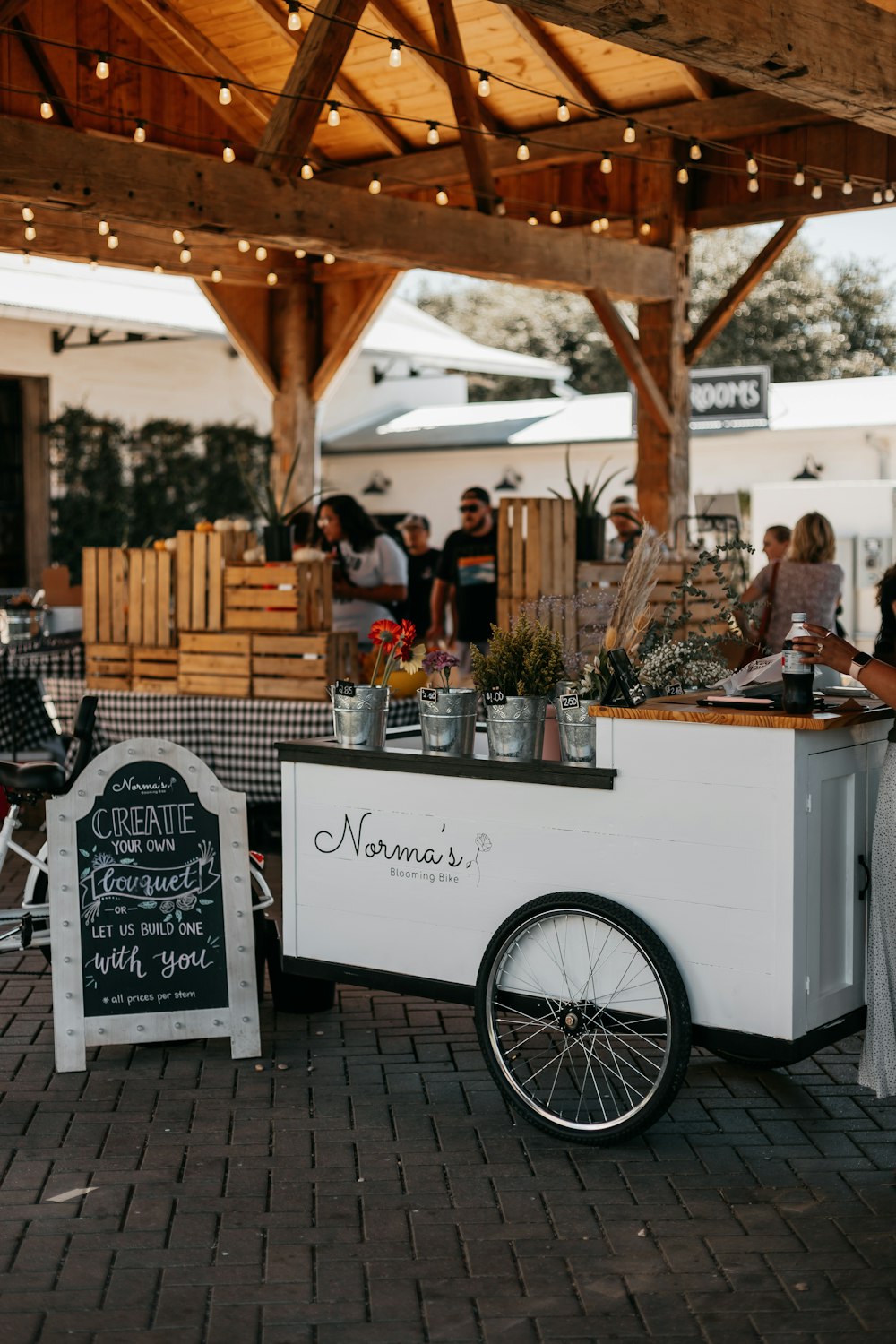 a food cart with a sign on the side of it