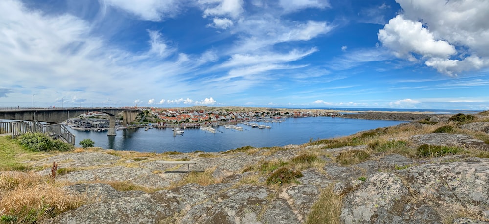 a large body of water with a bridge in the background