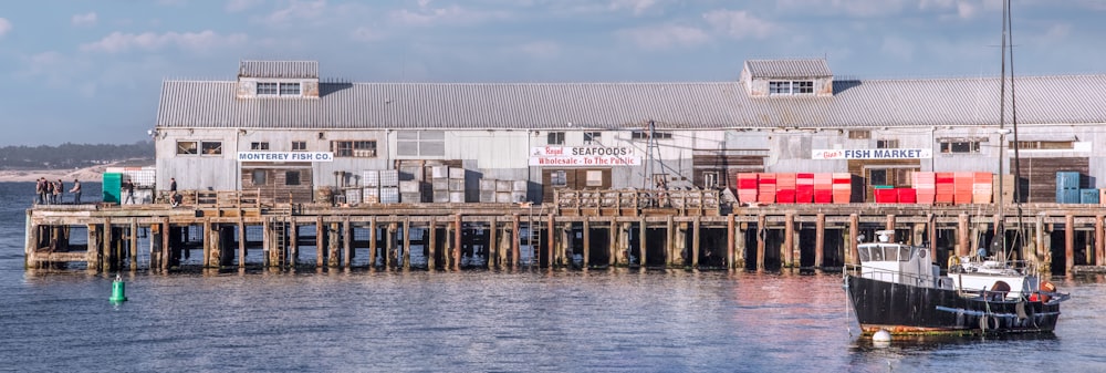 a boat is docked in front of a building