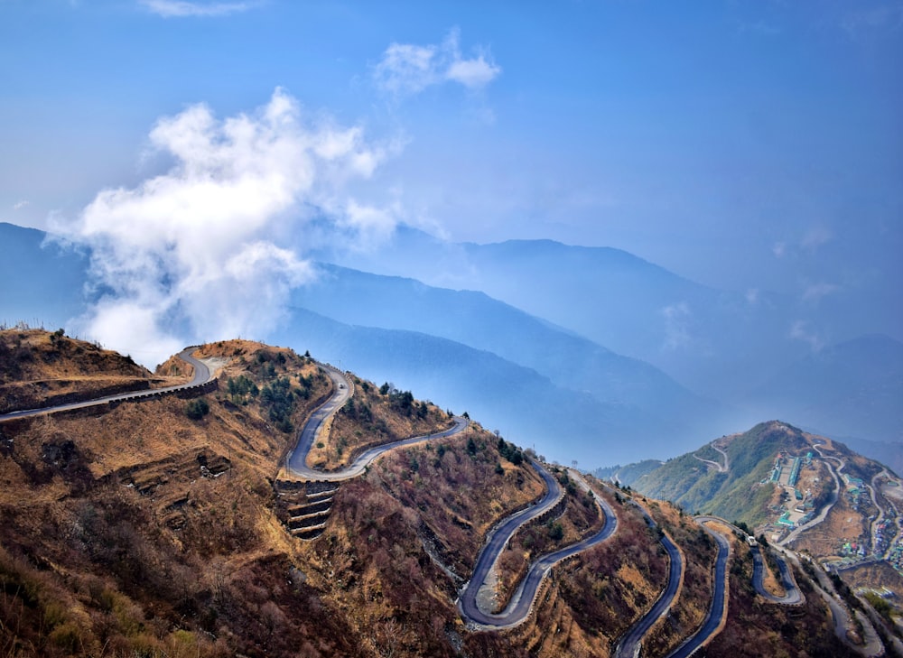 a scenic view of a winding mountain road