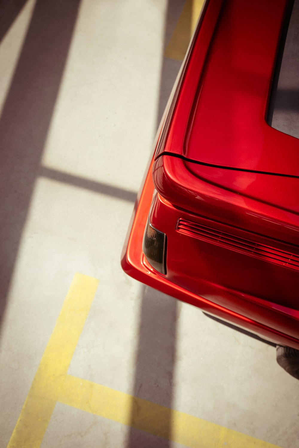 a red car parked in a parking lot