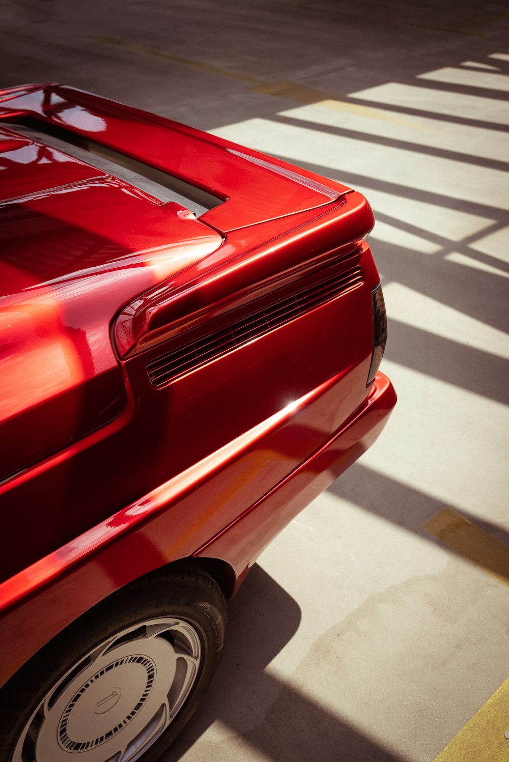 a red sports car parked in a parking lot