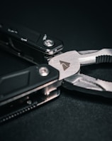 A close-up of a first responder's hands holding a rescue tool.