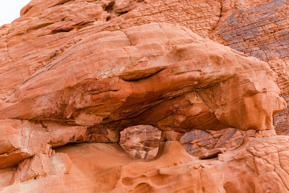 a rock formation with a face carved into it