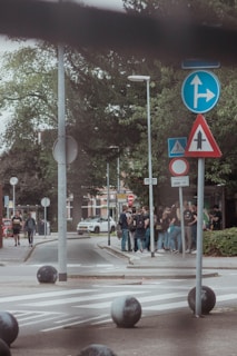 A small group of learners discussing traffic signs during a classroom session.