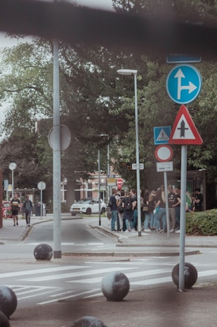 A small group of learners discussing traffic signs during a classroom session.