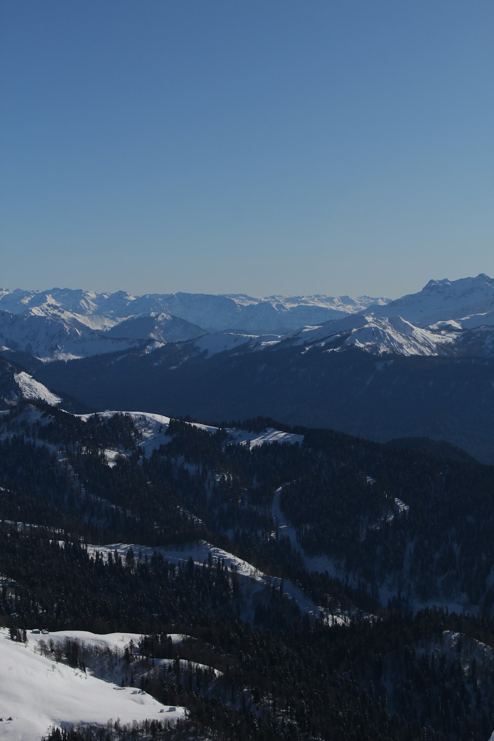a view of a snowy mountain range from a high point of view