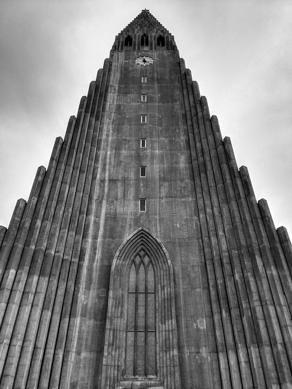 a very tall building with a clock on it's side