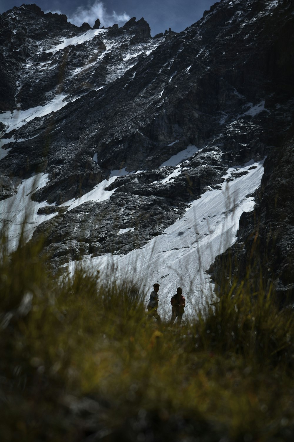 a couple of people that are standing in the snow