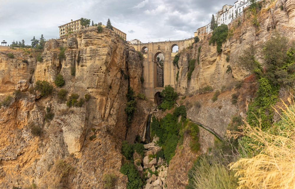 a bridge that is built into the side of a cliff