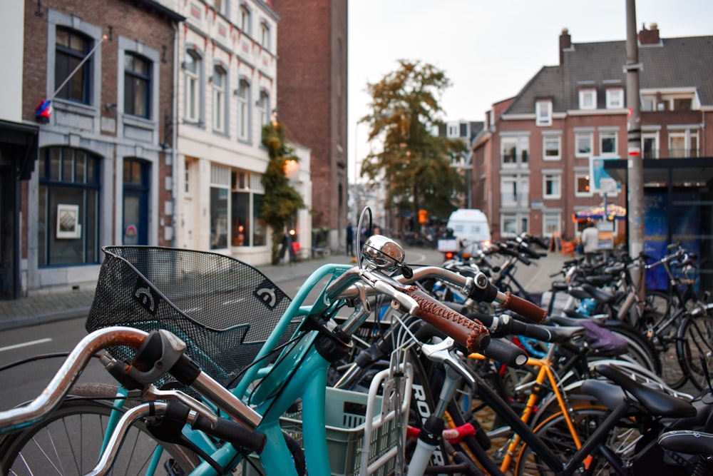 a row of bikes parked next to each other on a street