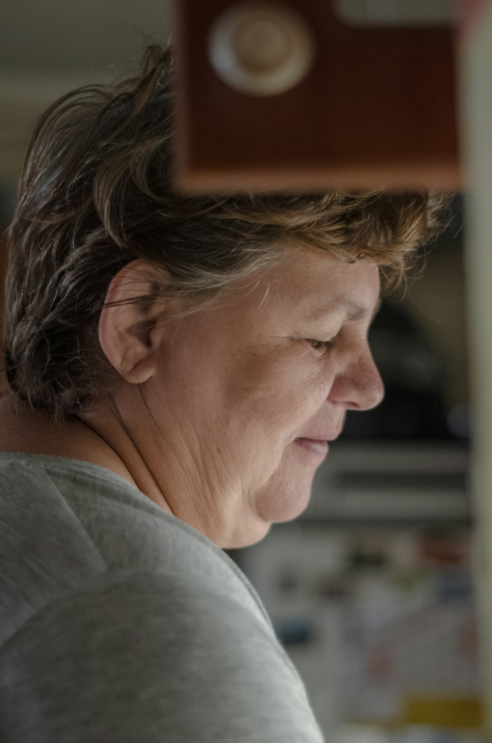 a woman is looking at a cell phone