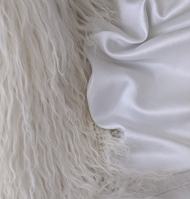 a close up of a white fur coat