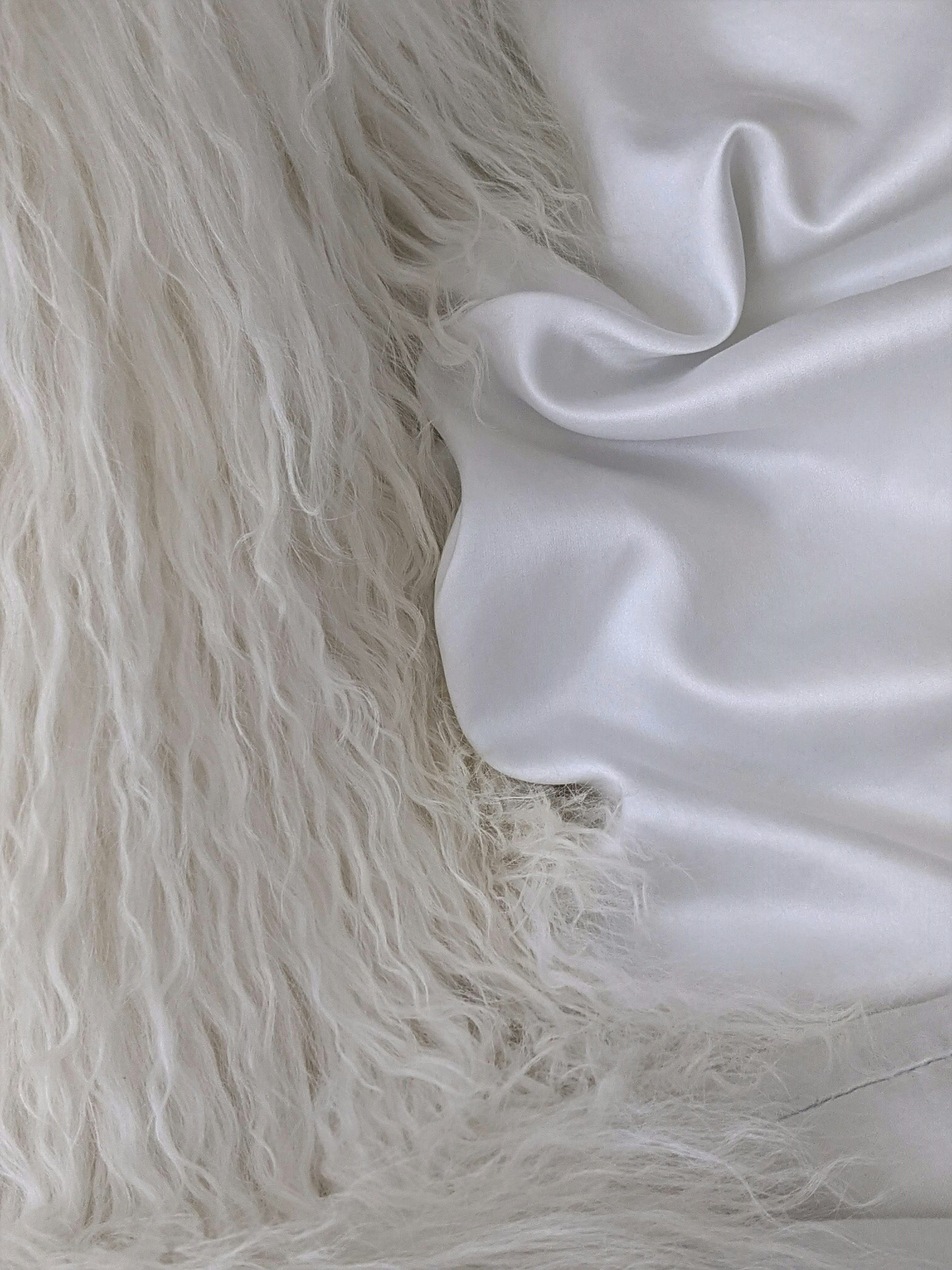 a close up of a white fur coat