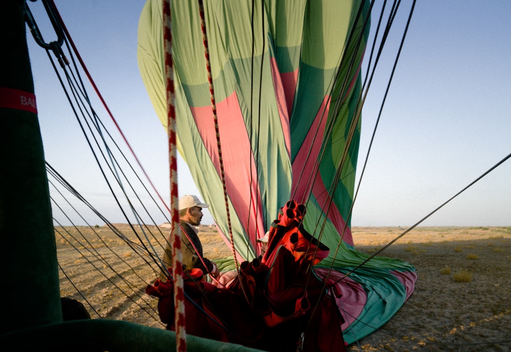 a person sitting inside of a hot air balloon