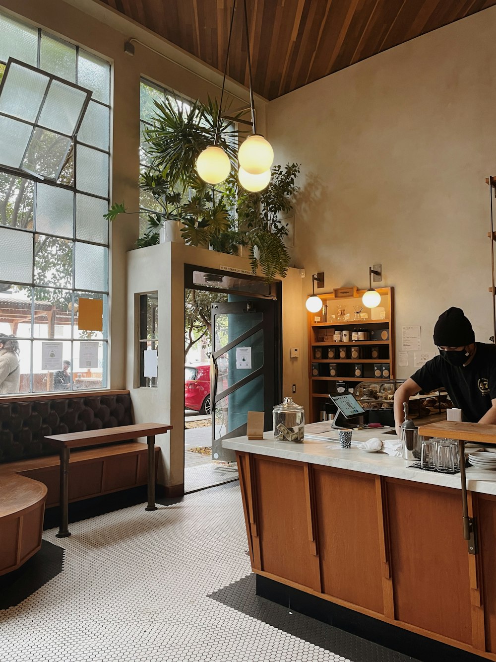 a man sitting at a counter in a restaurant