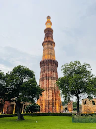 a tall tower with a clock on the top of it