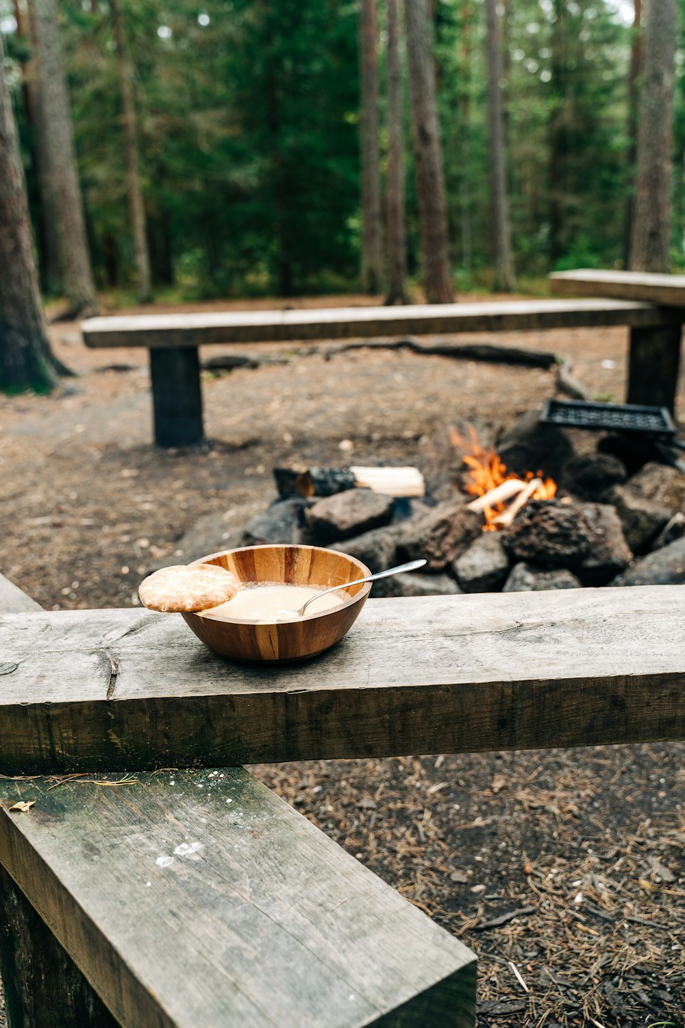 a wooden bowl sitting on top of a wooden bench