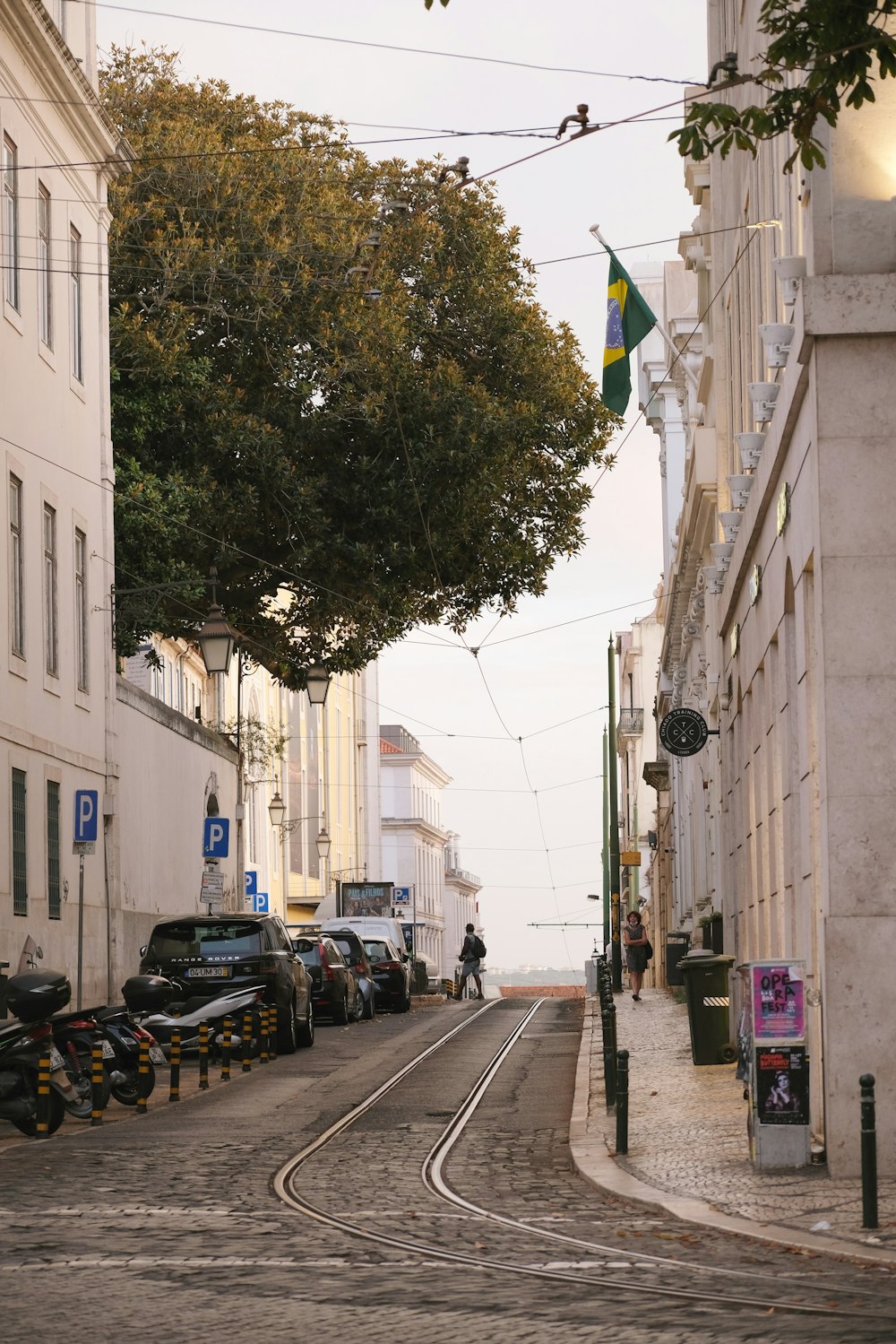 a street with cars parked on the side of it