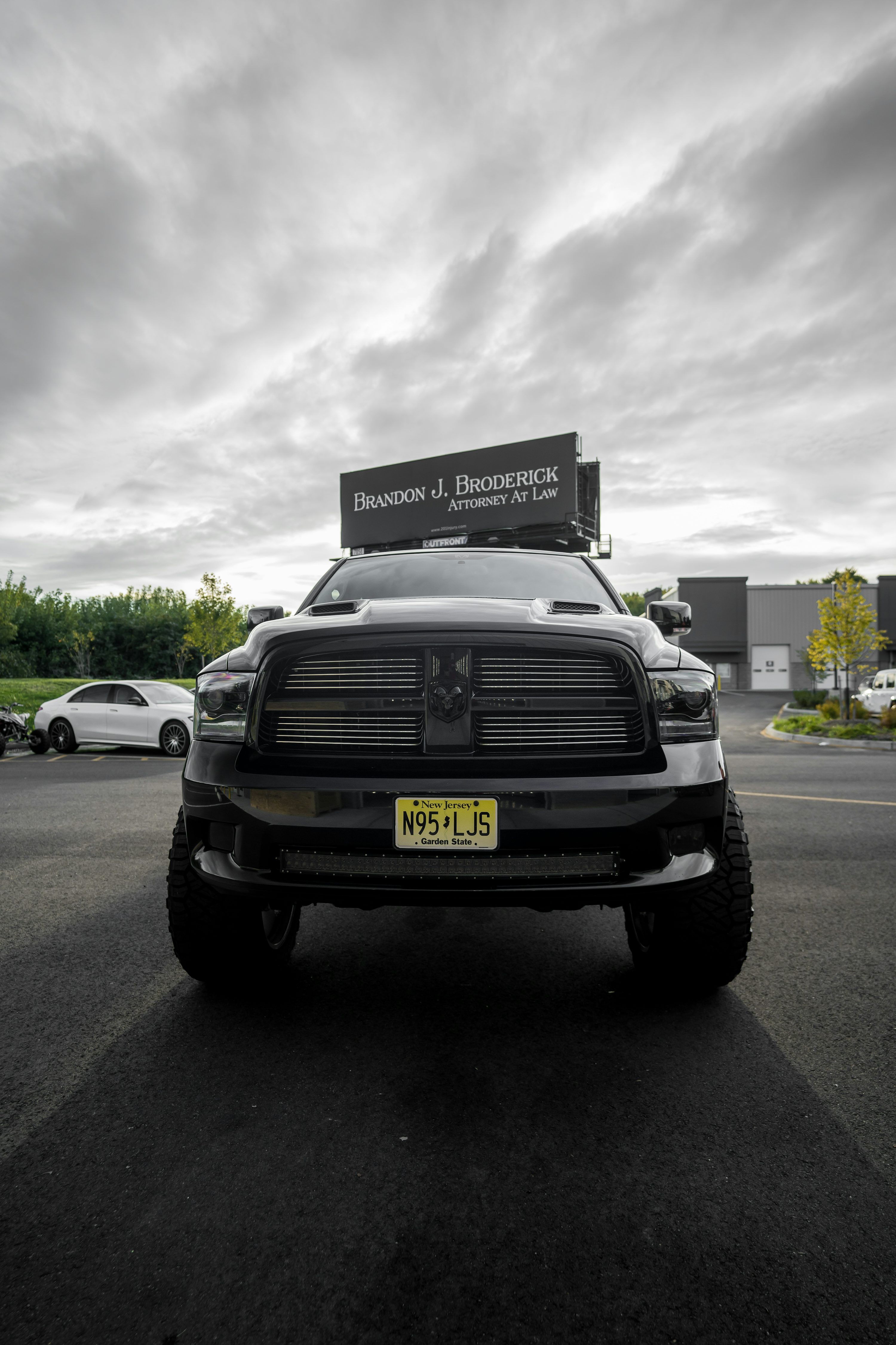 a black truck parked in a parking lot