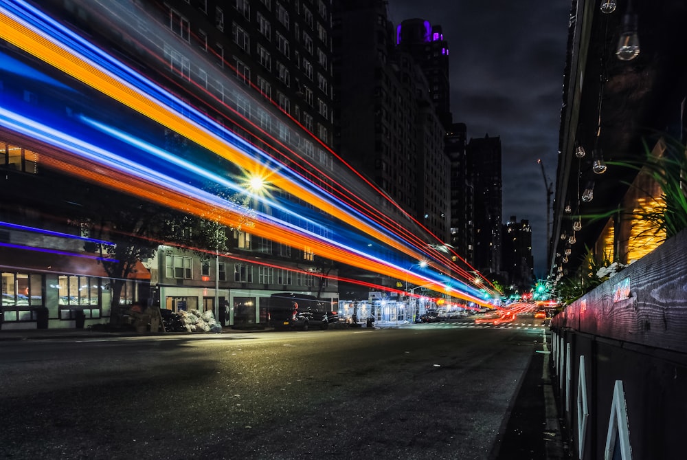 a city street filled with lots of traffic at night