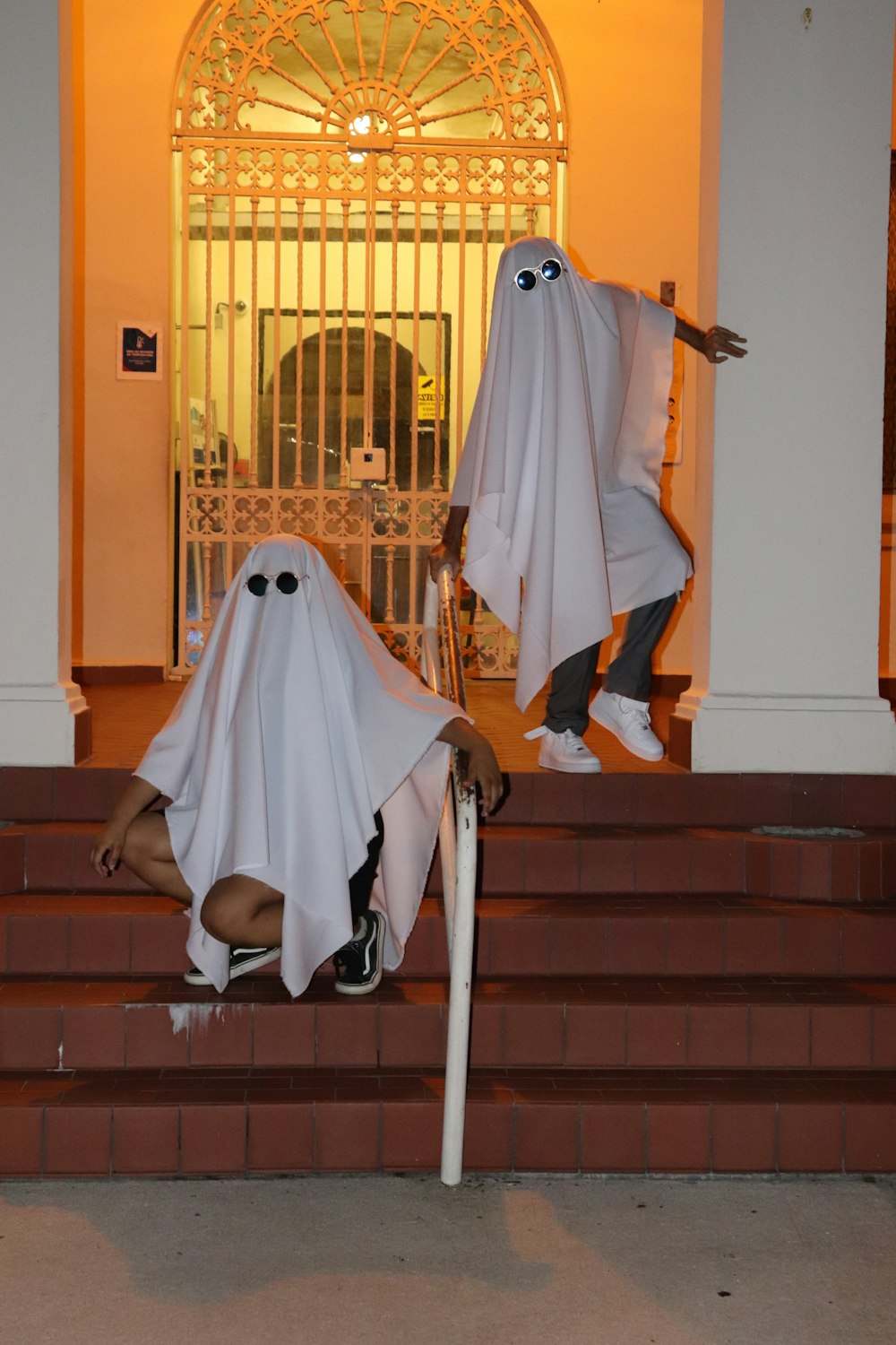 a couple of people that are standing on some steps