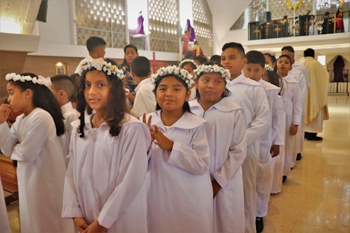 a group of young children standing next to each other