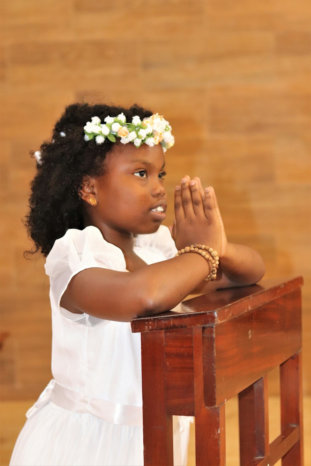 a little girl with a flower in her hair