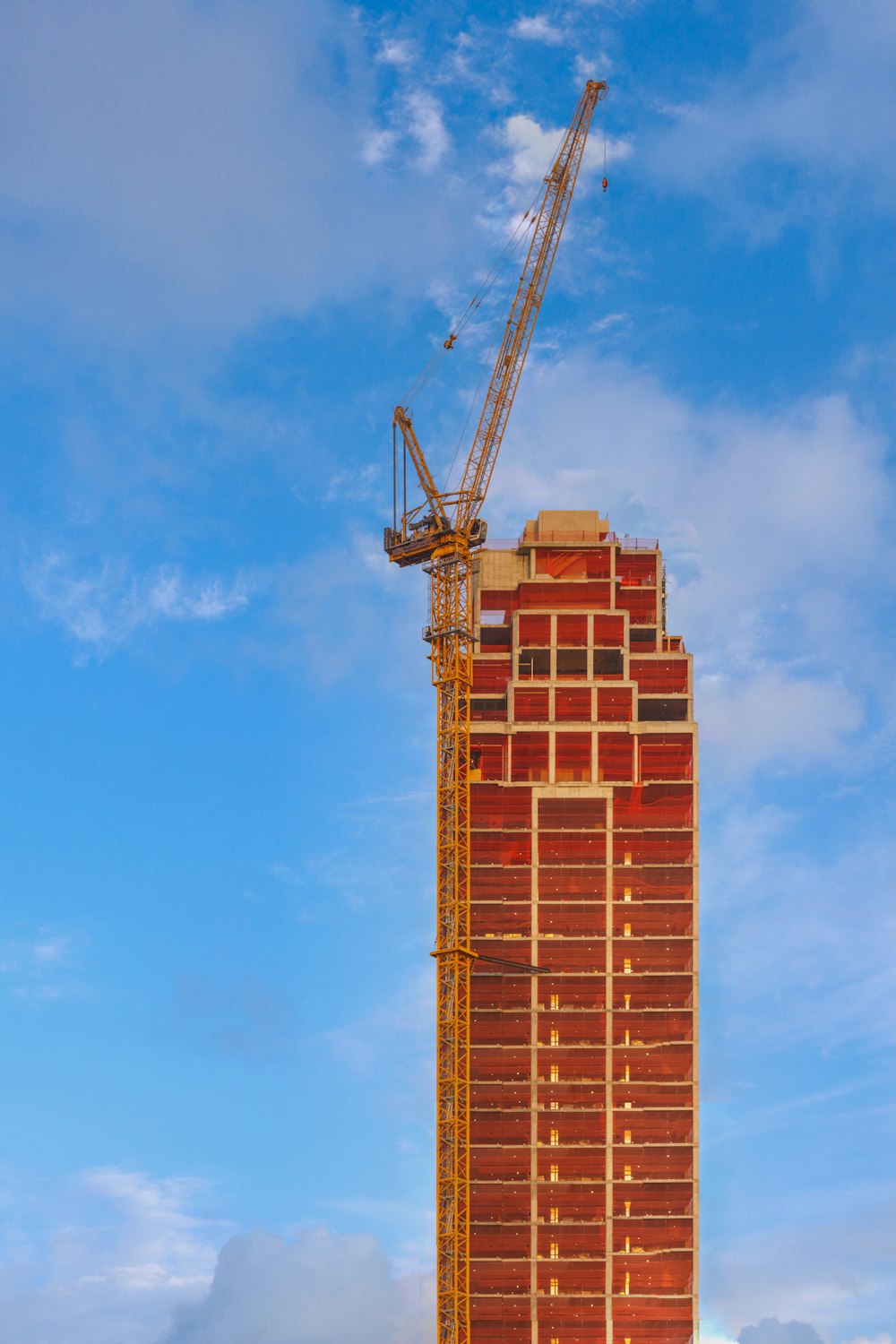 a tall building with a crane on top of it