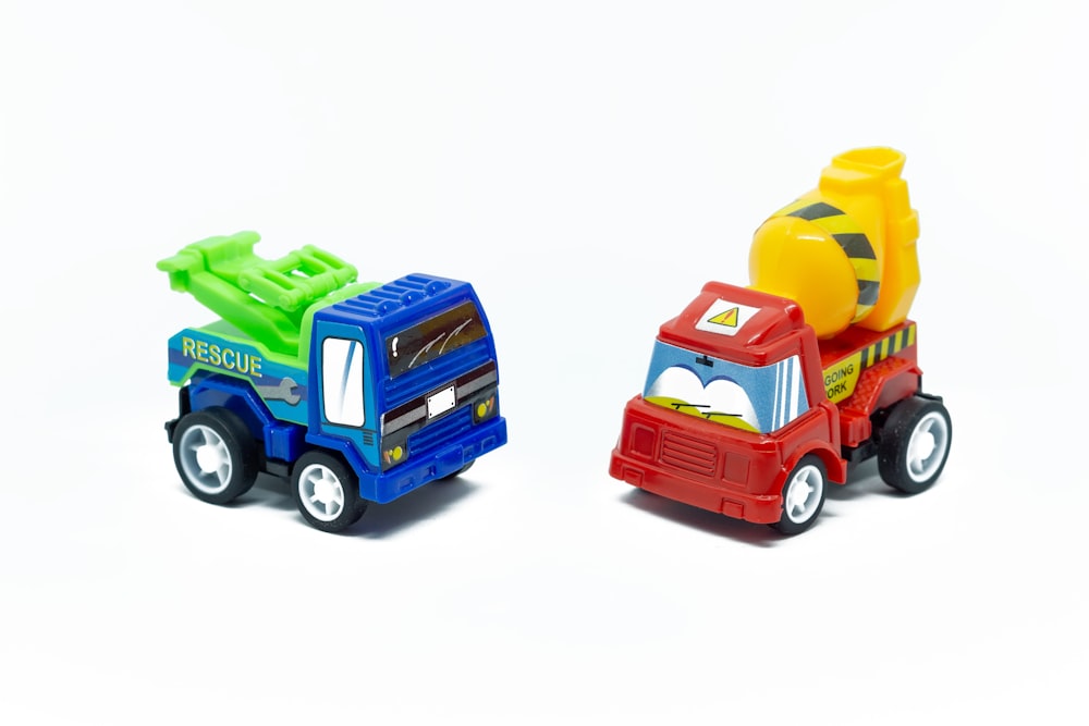 a couple of toy trucks sitting next to each other