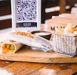 a basket of food sitting on top of a wooden table