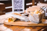 a basket of food sitting on top of a wooden table