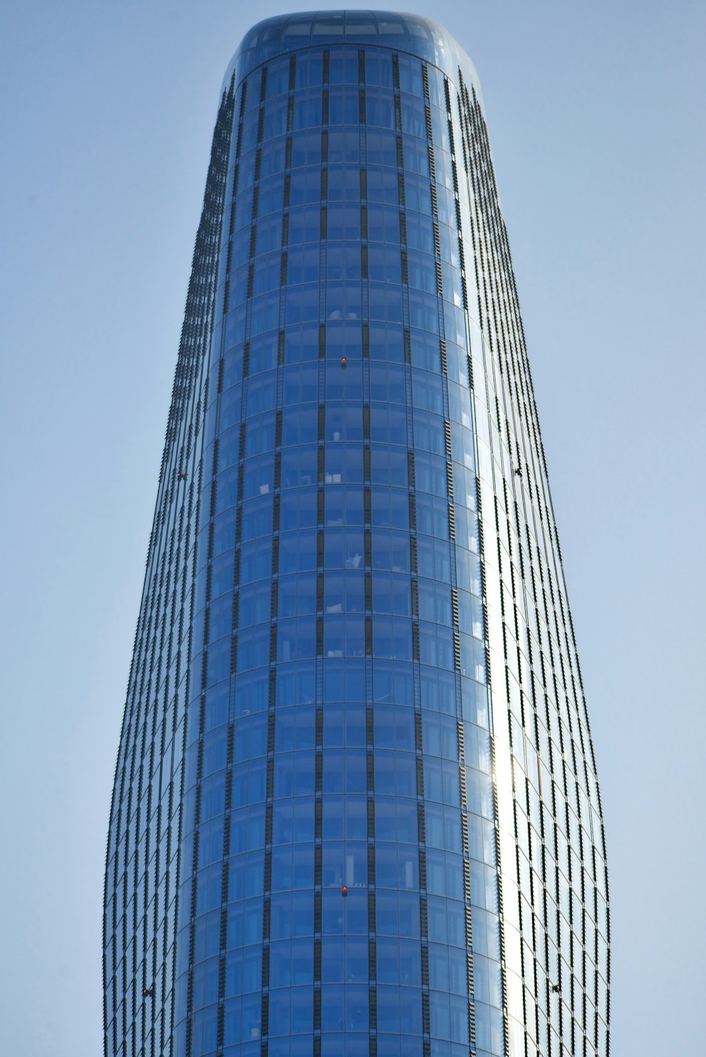 a very tall building with a sky background