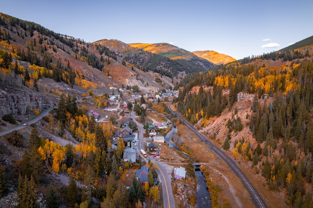 an aerial view of a town in the mountains