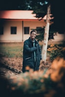 Smiling faces of people receiving coats and blankets during a mobile outreach event in an urban park