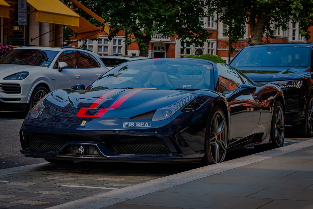 a black sports car parked on the side of the road