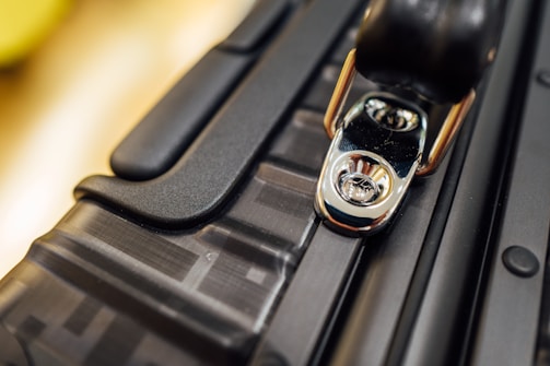 Close-up of a portable cooler's sturdy latch and insulated walls.