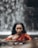 a woman in a red dress is in the water