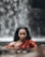 a woman in a red dress is in the water