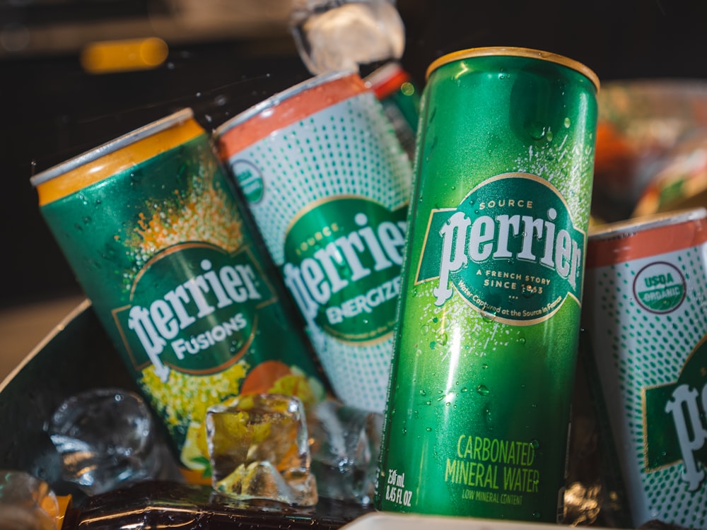 a couple of cans of beer sitting on top of a table