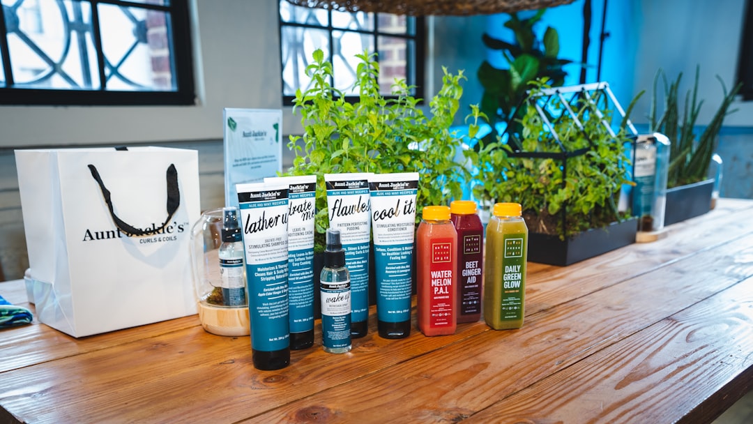a wooden table topped with bottles of juice, Product photography