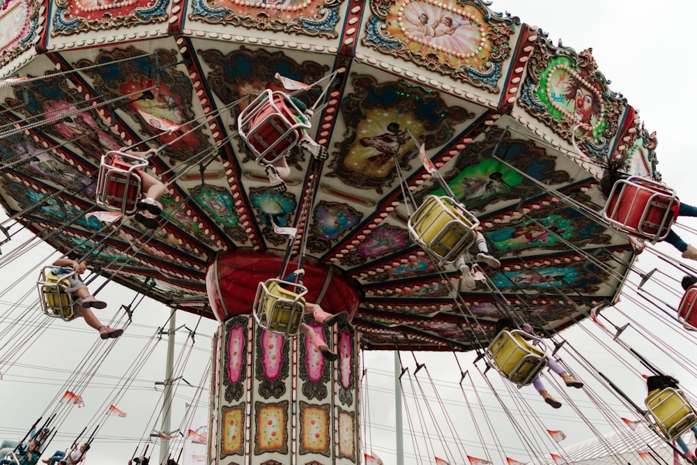 a carnival ride with people riding on it