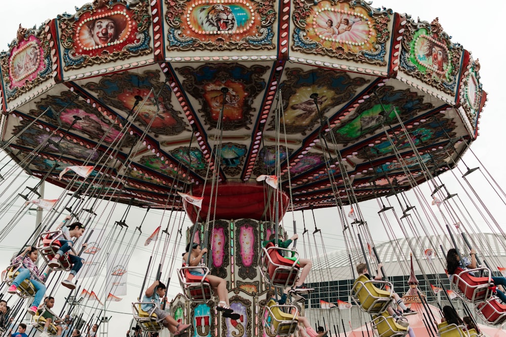 a carnival ride with people riding on it