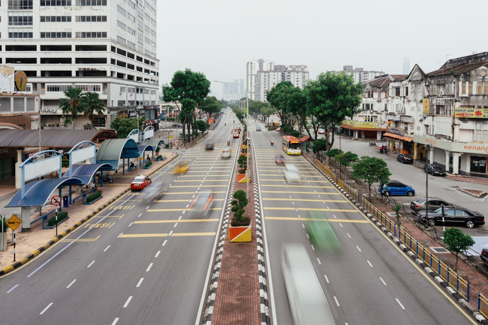 a city street with cars driving down it