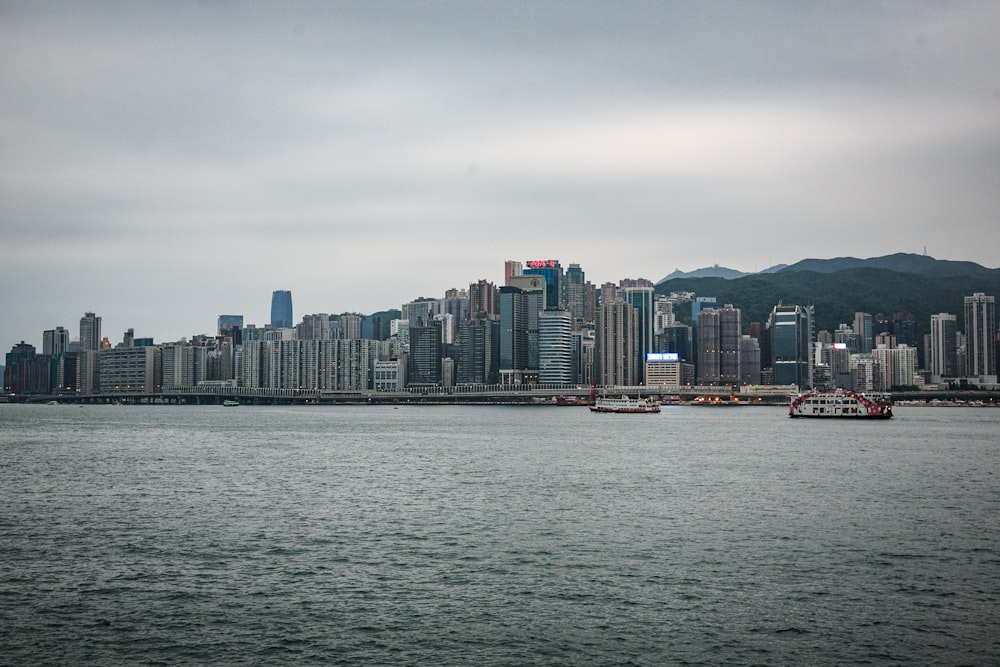 a large body of water with a city in the background