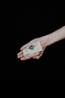 a person holding a card in their hand